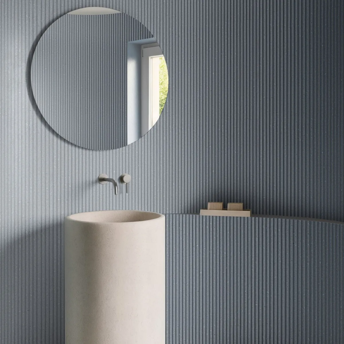 Blue Reed panels with fine vertical ribs on a curved bathroom wall behind a stone basin