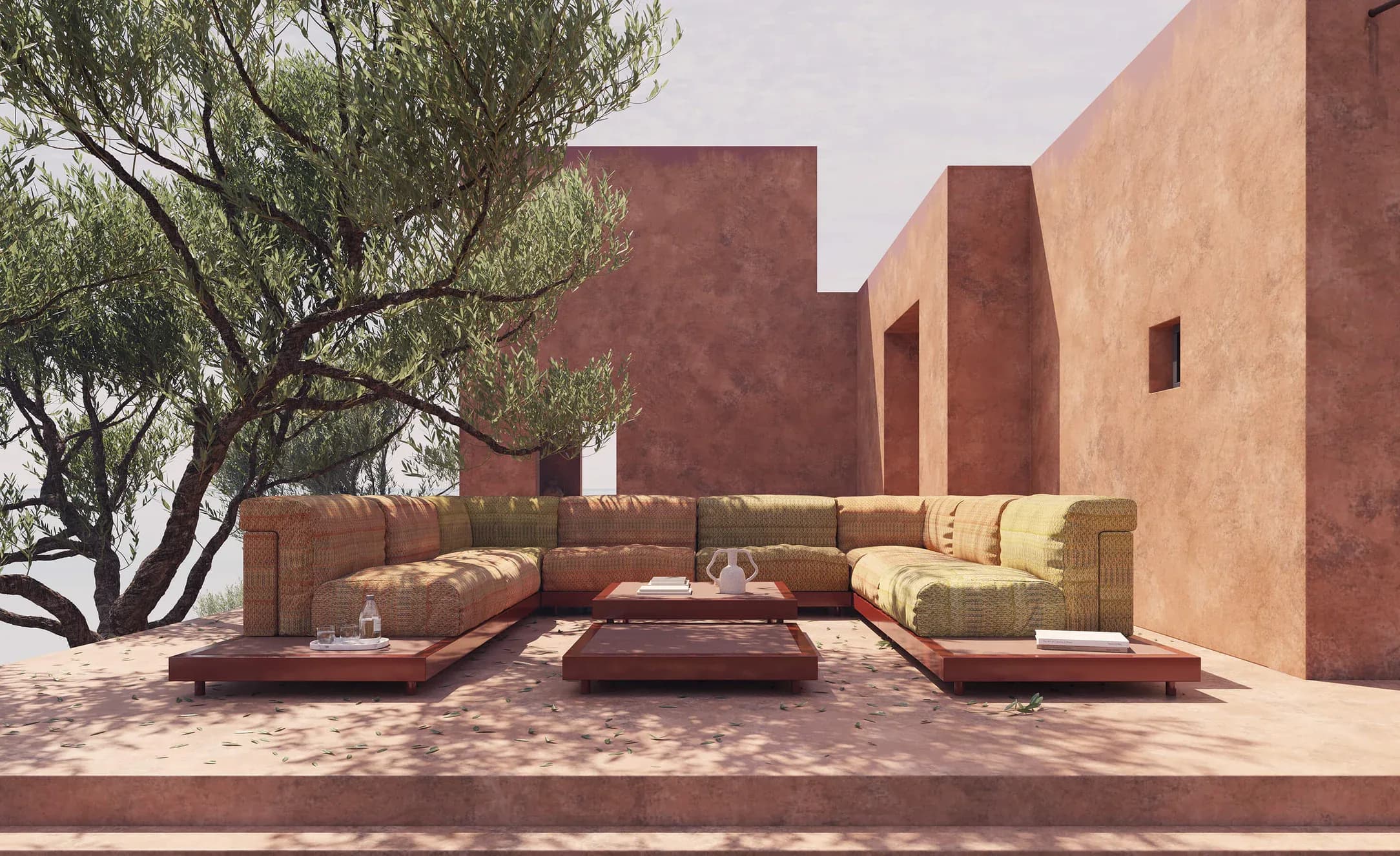 Musola Boira Metal sofas in ochre and sand on a terrace between terracotta walls