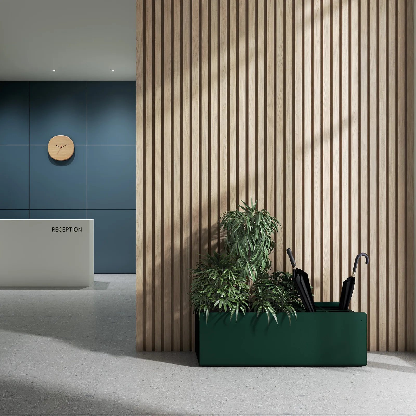 A green Crepe umbrella stand and planter beside a timber screen and reception desk