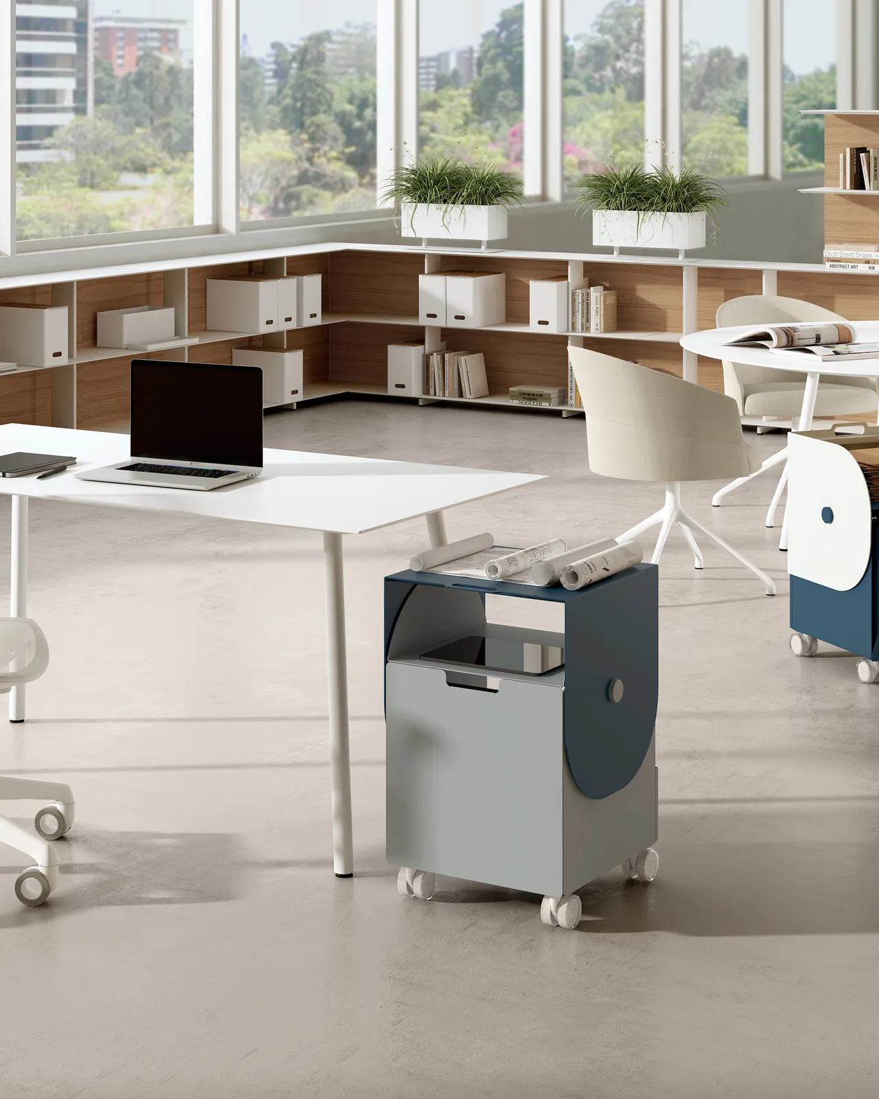 A grey Flip mobile storage unit beside white desks in a bright office