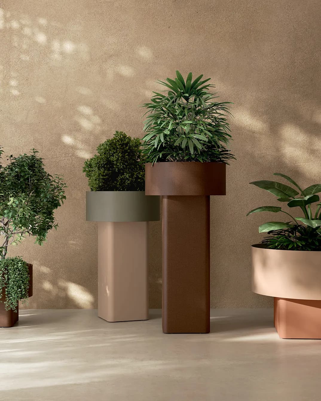 Verissimo planters in brown, green and terracotta at different heights against a warm wall
