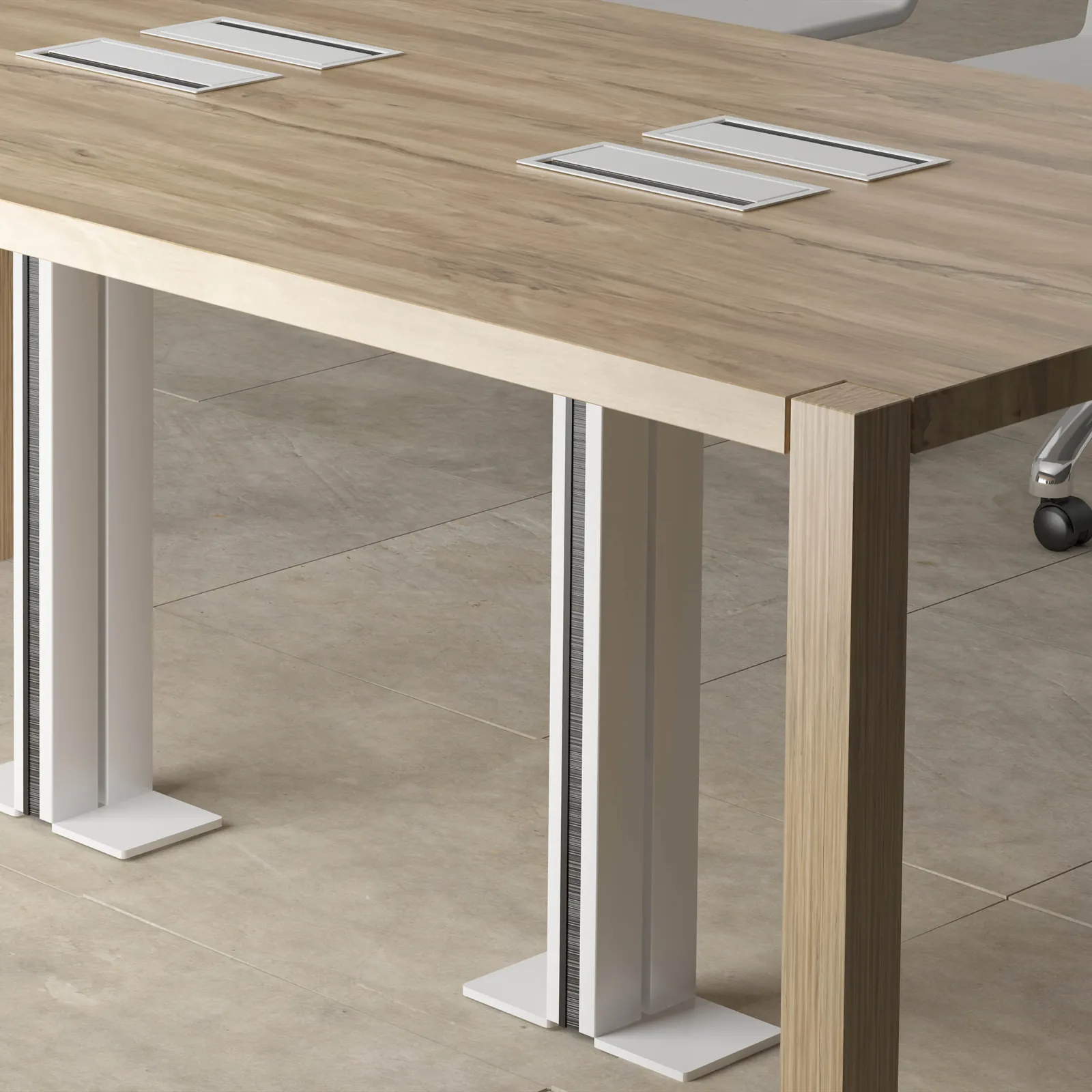 Wire columns carrying cables up to a timber meeting table