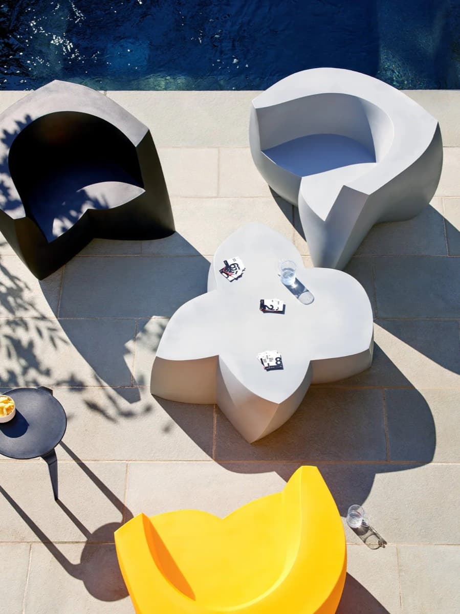 Frank Gehry chairs by Heller arranged poolside